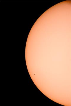 Planet Mercury transits across the face of the Sun