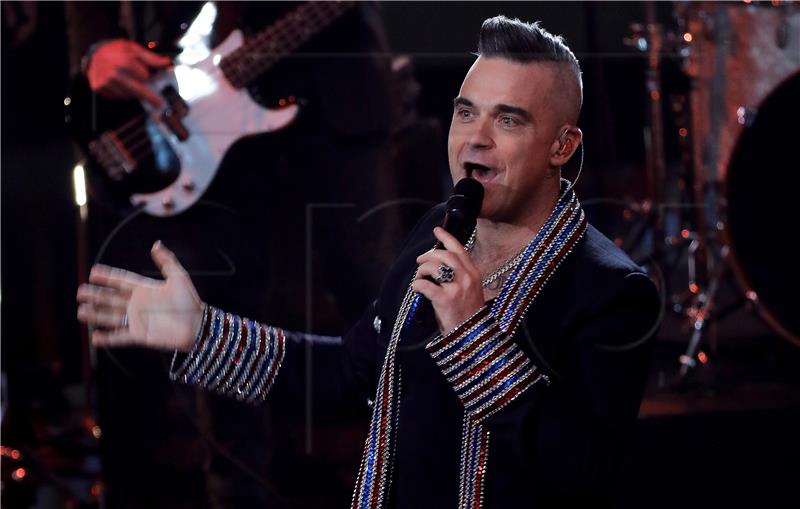 Robbie Williams 13. put najslušaniji u Britaniji, poput Elvisa Presleya