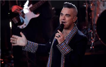 Robbie Williams 13. put najslušaniji u Britaniji, poput Elvisa Presleya