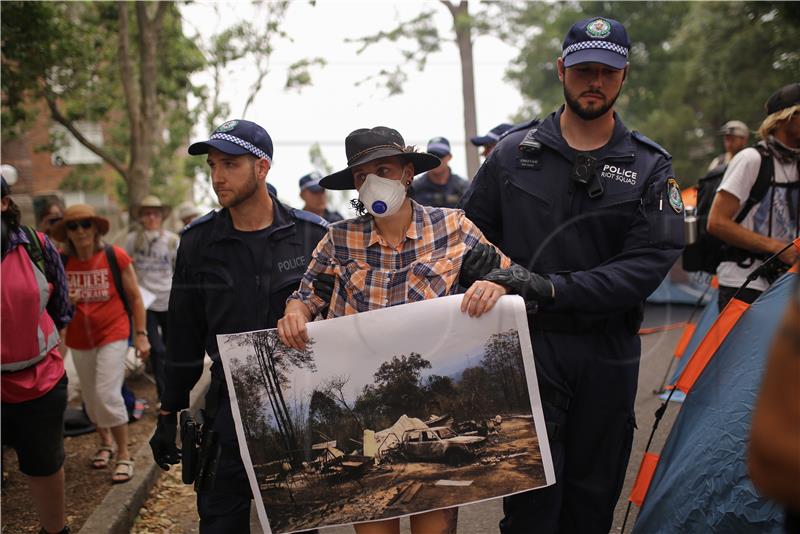 Protesters denounce prime minister's holiday leave amid Australia fire crisis