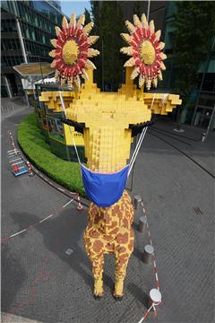 Lego giraffe gets a face mask in Berlin