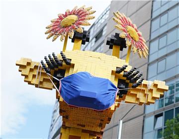 Lego giraffe gets a face mask in Berlin