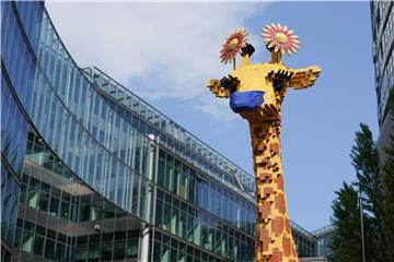 Lego giraffe gets a face mask in Berlin