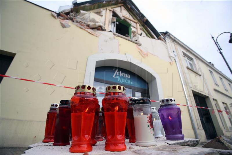 Wreath laid, candles lit for seven killed in earthquake