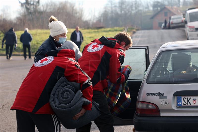 Some Red Cross volunteers, whose homes were also damaged,  help others - JL 