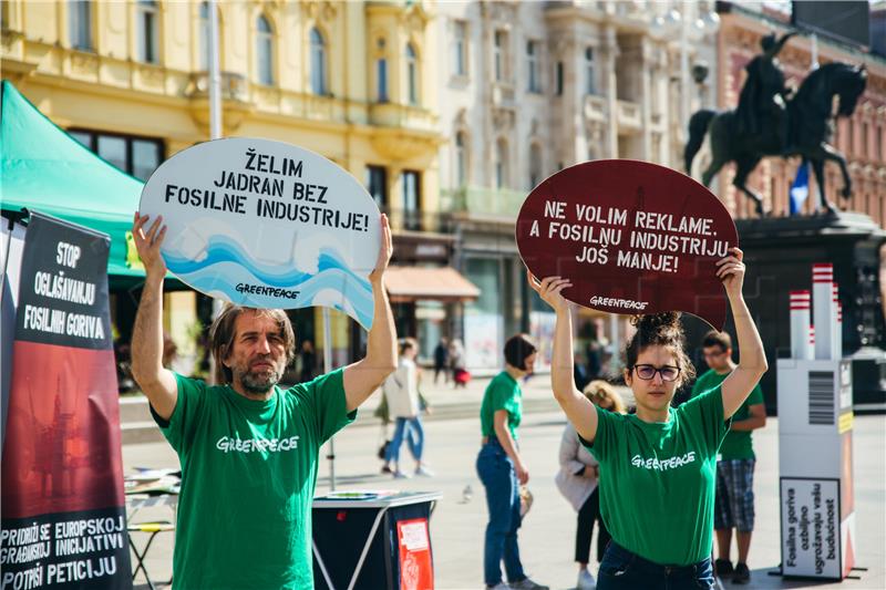 Greenpeace activists collecting signatures to ban fossil fuels