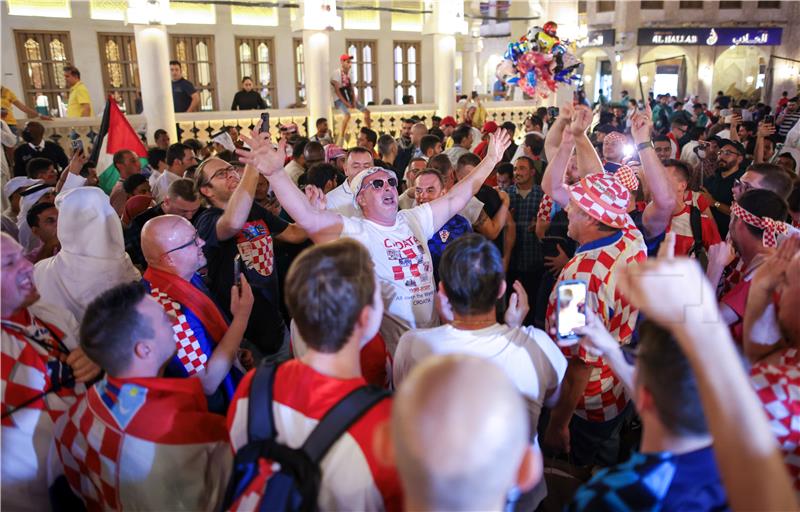 Croatian football supporters throw party in downtown Doha