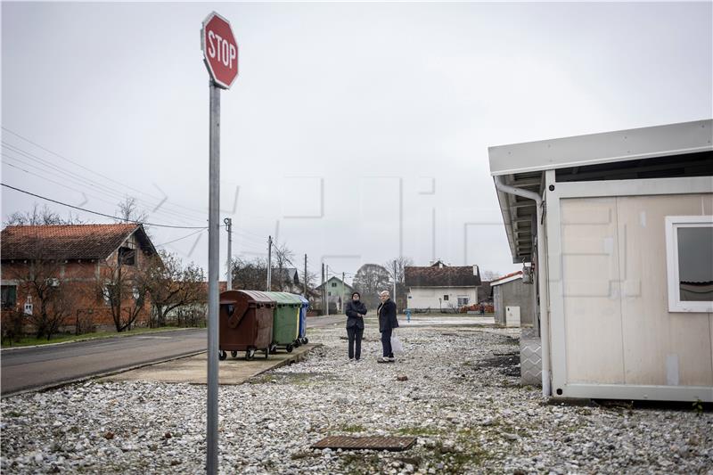 Prefabricated wooden homes replace container settlement in Glina