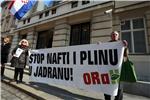 Activists stage performance outside Parliament in protest at drilling in Adriatic