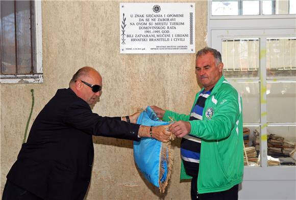 Former Serb-run concentration camp inmates put up memorial plaques