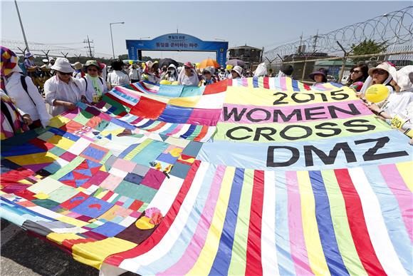 SOUTH KOREA INTERNATIONAL PEACE WOMEN ACTIVIST CROSS DMZ