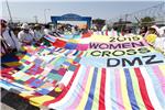 SOUTH KOREA INTERNATIONAL PEACE WOMEN ACTIVIST CROSS DMZ