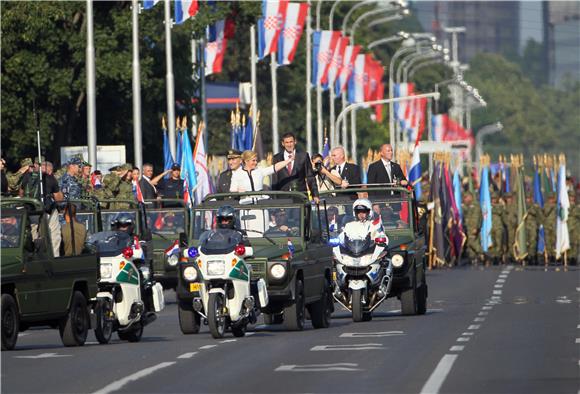 Military parade participants marching through Zagreb