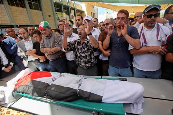 MIDEAST ISRAEL PALESTINIANS FIRE VICTIM FUNERAL