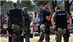 Macedonian police push migrants back from border