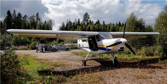 SWEDEN LIGHT PLANE LANDS ON HIGHWAY