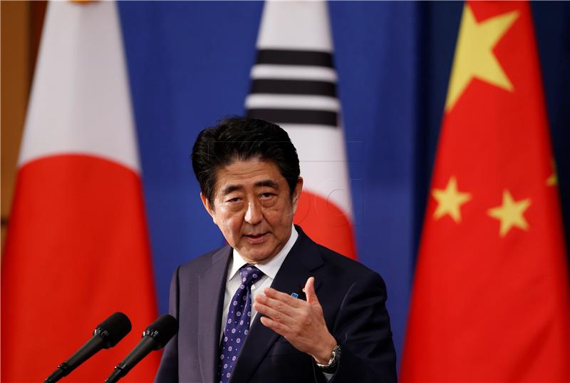 Japanese Prime Minister Shinzo Abe speaks during a news conferen