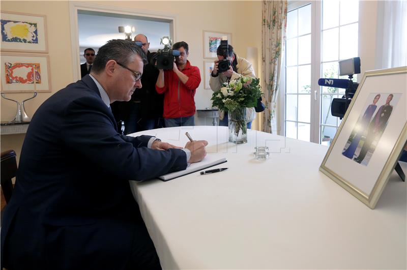 PM Oreskovic signs book of condolences; Belgian ambassador says touched