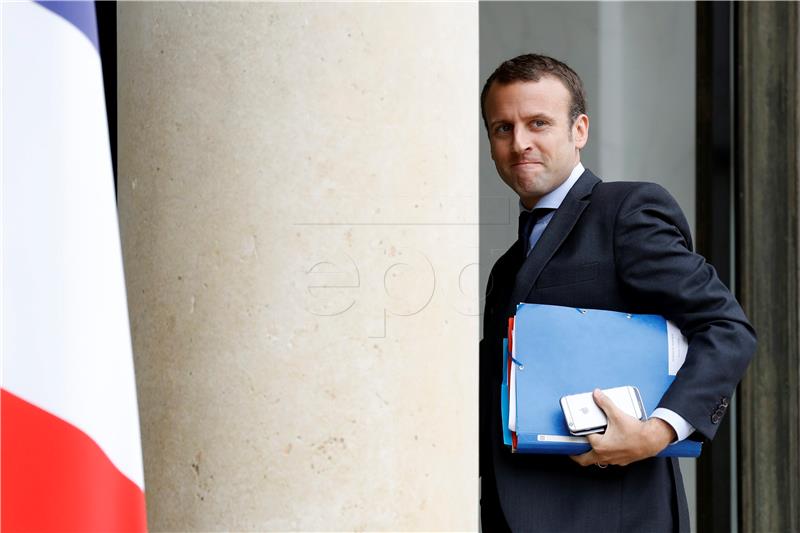 FILE FRANCE MACRON MINISTER RESIGNS