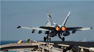 AT SEA IRAQ SYRIA AIR STRIKES