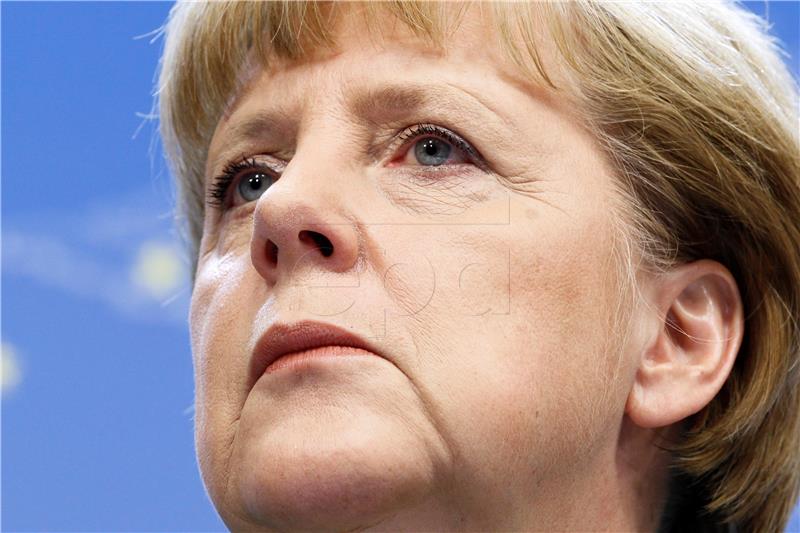 (FILE) BELGIUM GERMANY MERKEL DAVOS WEF