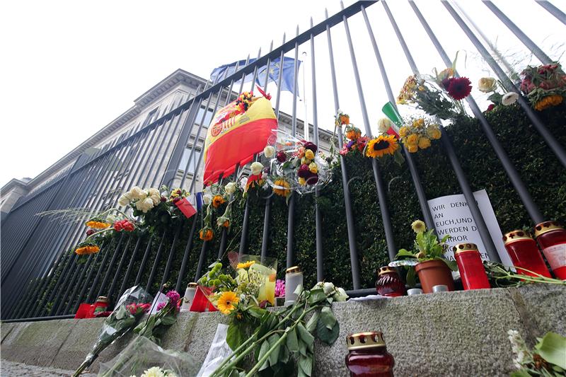 Flowers and candles in front of the Spanish Embassy