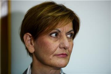 Economy minister says is doing her job, solving problems