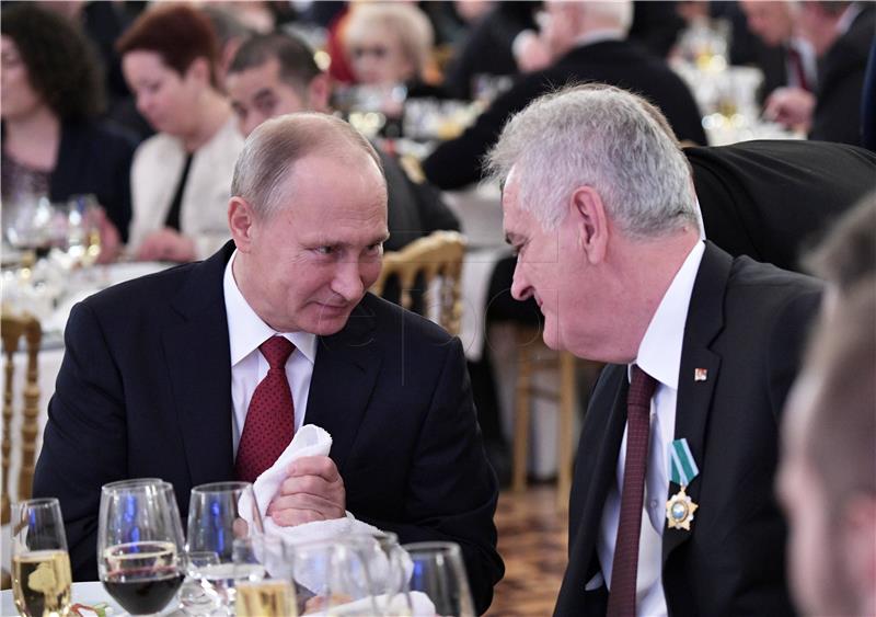 Putin presents former Serbian president with high state decoration