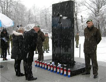 Monument unveiled to 12 defenders, civilians exhumed from mass grave