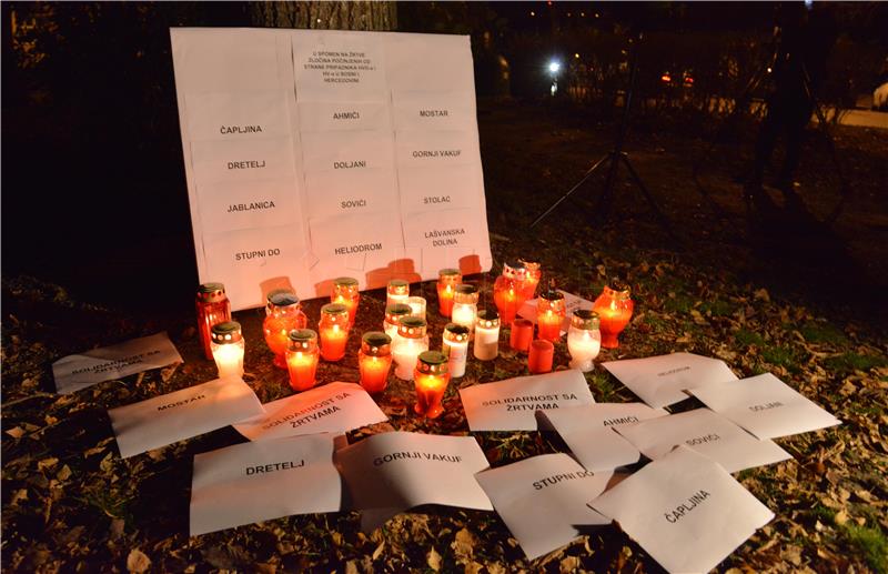 Group of activists light candles for victims of war crimes in Bosnia