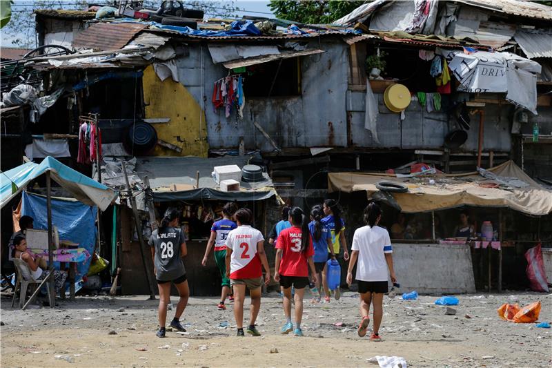 PHILIPPINES PHOTO ESSAY STREET CHILD WORLD CUP