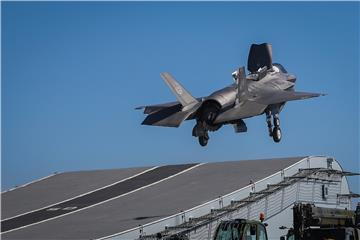 AT SEA BRITAIN USA DEFENCE F35 LANDS ON CARRIER