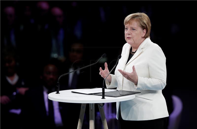 German Chancellor Angela Merkel delivers a speech at the opening